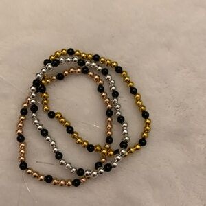 Three metallic beaded handmade bracelets